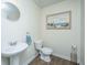 Small bathroom featuring hardwood floors, sink, toilet and matching wall art at 124 Bright Meadow Rd, Summerville, SC 29483