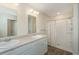Bright bathroom featuring double sinks, sleek white cabinetry, and a shower with a decorative shower curtain at 124 Bright Meadow Rd, Summerville, SC 29483