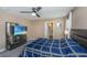 This cozy bedroom features a ceiling fan, dresser, and a television mounted in front of the bed at 124 Bright Meadow Rd, Summerville, SC 29483