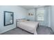 Bright, carpeted bedroom with a large window and a mirrored wall gives the illusion of added space at 124 Bright Meadow Rd, Summerville, SC 29483