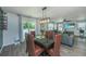 Dining room adjacent to living room with modern lighting and access to the backyard at 124 Bright Meadow Rd, Summerville, SC 29483