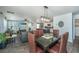 Open concept living and dining area with hardwood floors and plenty of sunlight at 124 Bright Meadow Rd, Summerville, SC 29483