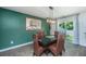 Dining room features modern light fixture, hardwood floors, and a large wall painting at 124 Bright Meadow Rd, Summerville, SC 29483