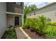 A welcoming entrance to a townhouse with attractive landscaping and a stylish front door at 124 Bright Meadow Rd, Summerville, SC 29483