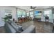 Open living room with hardwood floors, large windows, and mounted television at 124 Bright Meadow Rd, Summerville, SC 29483