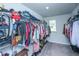 Organized walk-in closet featuring shelving and hanging rods for ample storage with natural light at 124 Bright Meadow Rd, Summerville, SC 29483