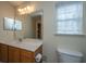 Bright bathroom with a single sink vanity and a framed mirror at 1304 Elm Hall Cir, Summerville, SC 29483