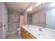Bathroom features a double sink vanity, and a shower with curtain and safety bar at 1304 Elm Hall Cir, Summerville, SC 29483