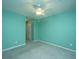 This spacious bedroom has carpeted floors, a large closet, and a lighted ceiling fan at 1304 Elm Hall Cir, Summerville, SC 29483