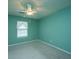 Empty bedroom featuring green walls, neutral carpet, a window and ceiling fan at 1304 Elm Hall Cir, Summerville, SC 29483