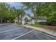 Community clubhouse with white siding, a covered entrance, parking spaces, and surrounding trees and landscaping at 1304 Elm Hall Cir, Summerville, SC 29483
