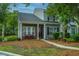 Attractive townhome facade with tidy landscaping, a cozy bench, and coordinated exterior colors at 1304 Elm Hall Cir, Summerville, SC 29483