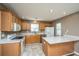 Spacious kitchen features granite countertops, stainless steel appliances, and ample cabinet space at 1304 Elm Hall Cir, Summerville, SC 29483