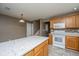 Bright kitchen with granite countertops, white appliances, and wooden cabinets at 1304 Elm Hall Cir, Summerville, SC 29483