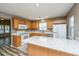 Well-lit kitchen featuring a center island, stainless steel appliances, and mosaic tile backsplash at 1304 Elm Hall Cir, Summerville, SC 29483