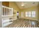 Bright living room boasting high ceilings, wood floors, and a unique built-in shelving unit at 1304 Elm Hall Cir, Summerville, SC 29483