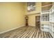 Inviting living room showcasing wood floors, high ceilings, and a grand staircase at 1304 Elm Hall Cir, Summerville, SC 29483