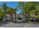 A building near the pool featuring white siding and a covered entrance at 1304 Elm Hall Cir, Summerville, SC 29483