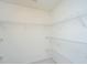 Empty walk-in closet featuring metal shelving for efficient storage at 1304 Elm Hall Cir, Summerville, SC 29483