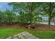 A view of the yard featuring greenery, mulch, and a partially obstructed view of neighboring homes at 1304 Elm Hall Cir, Summerville, SC 29483