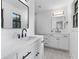 Bright bathroom featuring double vanities, modern fixtures, and stylish mirrors at 1320 Bresee St, Charleston, SC 29412