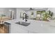 Kitchen island with stainless dishwasher and matte black faucet at 1320 Bresee St, Charleston, SC 29412