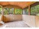 Charming screened porch with wood flooring and ceiling overlooking wooded backyard at 1320 Bresee St, Charleston, SC 29412