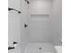 Modern bathroom with a walk-in shower featuring gray tile and a shower niche at 1320 Bresee St, Charleston, SC 29412