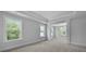 Large bedroom with tray ceiling, recessed lighting, and plenty of natural light from numerous windows at 135 Lilac Grove Way, Summerville, SC 29486