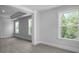 Large bedroom featuring coffered ceilings, plush carpeting, and picturesque windows at 135 Lilac Grove Way, Summerville, SC 29486