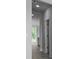 Hallway entrance leads to a modern kitchen with stainless steel appliances and great natural light at 135 Lilac Grove Way, Summerville, SC 29486
