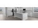 Bright kitchen featuring white cabinets, a center island, and ample counter space at 135 Lilac Grove Way, Summerville, SC 29486