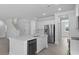 Open kitchen featuring white cabinets, stainless steel appliances, and a large island at 135 Lilac Grove Way, Summerville, SC 29486