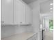 Close up of a kitchen featuring quartz countertops, white backsplash, and stainless steel appliances at 135 Lilac Grove Way, Summerville, SC 29486