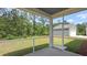 Screened-in porch with view of spacious backyard and garage at 135 Lilac Grove Way, Summerville, SC 29486