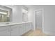 Bright bathroom featuring double vanity with white cabinets, white countertops, and modern fixtures at 139 Lilac Grove Way, Summerville, SC 29486