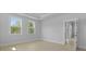 Well-lit bedroom featuring a tray ceiling and a doorway at 139 Lilac Grove Way, Summerville, SC 29486