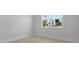 Bright bedroom with a large window overlooking the backyard and neutral paint at 139 Lilac Grove Way, Summerville, SC 29486