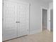 Bedroom with closet space featuring wood floors and neutral paint throughout at 139 Lilac Grove Way, Summerville, SC 29486