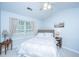 Bright bedroom featuring a queen-sized bed, bedside tables, and a window with natural light at 1401 Elm Hall Cir, Summerville, SC 29483