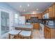 Bright kitchen with tile floors, wooden cabinets, a center island, and modern appliances at 1401 Elm Hall Cir, Summerville, SC 29483