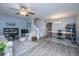 Bright living room with wood floors, modern furniture and decor with a staircase in view at 1401 Elm Hall Cir, Summerville, SC 29483