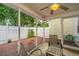 Relaxing screened-in patio with brick floors, ceiling fan, and patio furniture at 1401 Elm Hall Cir, Summerville, SC 29483