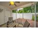 Relaxing screened-in patio with brick floors, ceiling fan, and patio furniture at 1401 Elm Hall Cir, Summerville, SC 29483