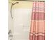 Bathroom shower stall with shower head and decorative pink patterned curtain at 1401 Elm Hall Cir, Summerville, SC 29483