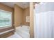 Bathroom with a bathtub and window providing natural light at 1409 Bloomingdale Ln, Mount Pleasant, SC 29466