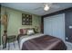 A bedroom featuring neutral decor, a ceiling fan, and a double closet at 1409 Bloomingdale Ln, Mount Pleasant, SC 29466