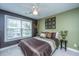 Cozy bedroom with a large window and decorative wall art at 1409 Bloomingdale Ln, Mount Pleasant, SC 29466