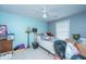 This bedroom features light blue walls, a ceiling fan and is cluttered with personal belongings at 1409 Bloomingdale Ln, Mount Pleasant, SC 29466