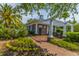 Charming community clubhouse with brick pathway, lush landscaping, and architectural details, perfect for gatherings at 1409 Bloomingdale Ln, Mount Pleasant, SC 29466
